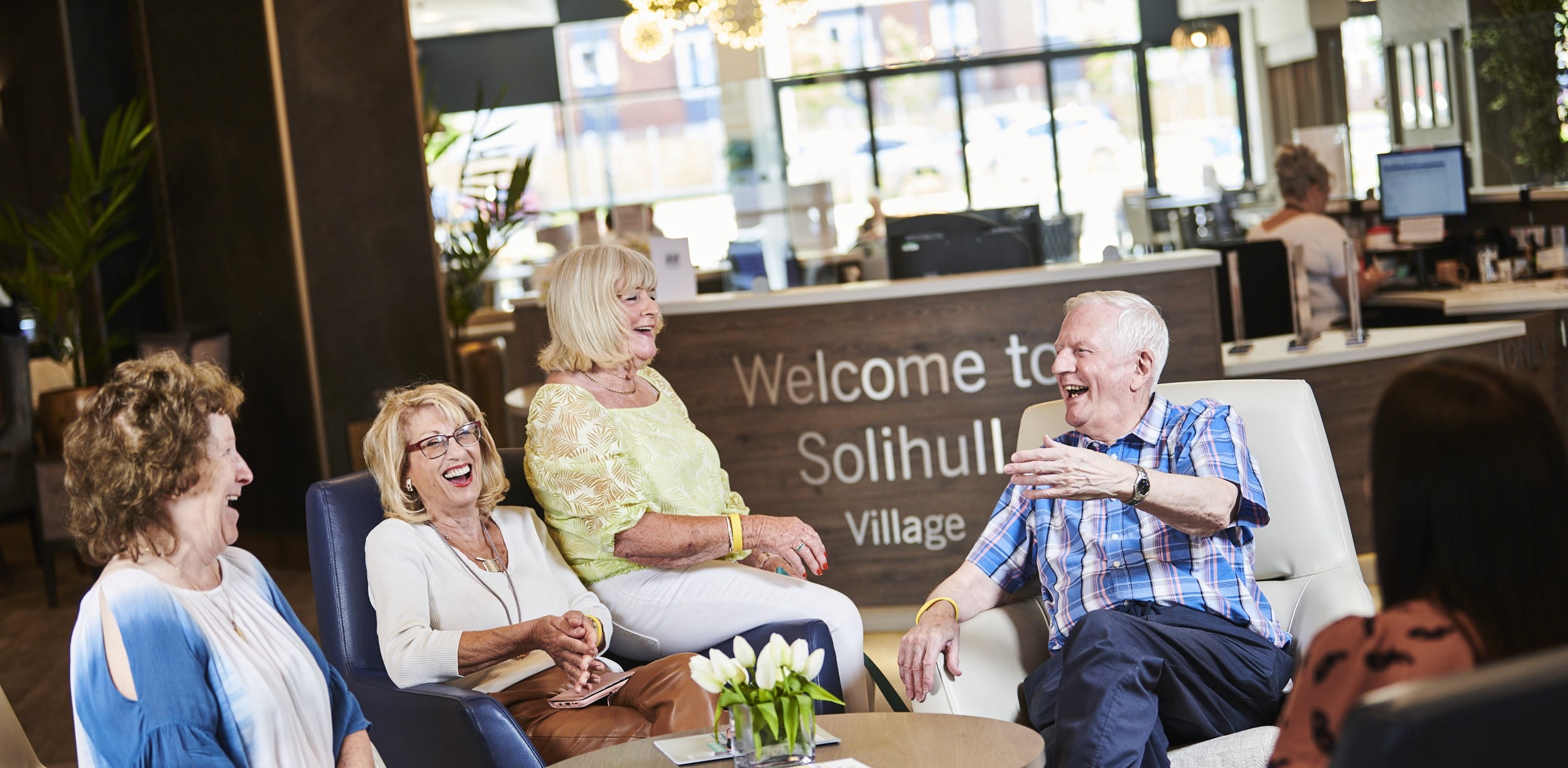 older people laughing together in residential community housing
